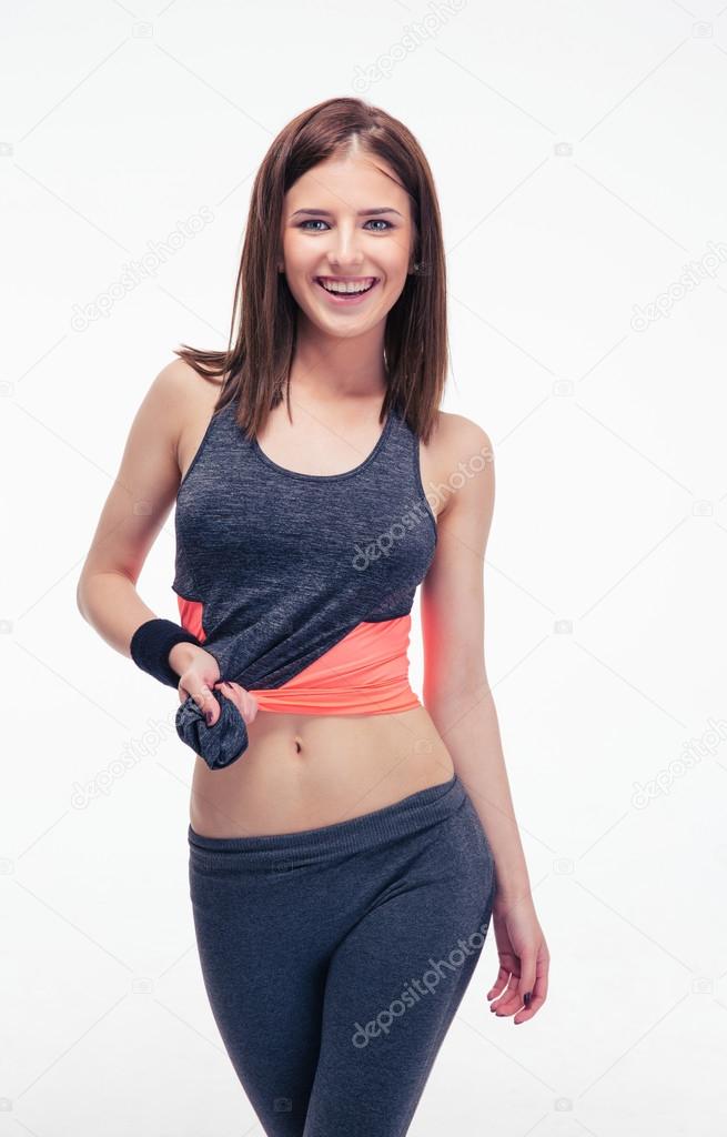Happy sporty woman posing isolated on a white background 