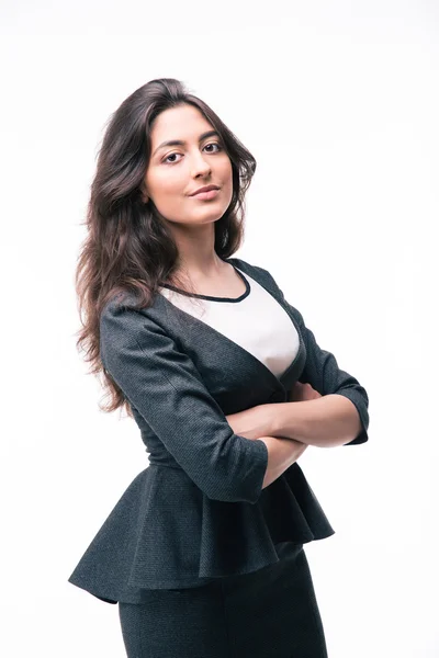 Serious businesswoman standing with arms folded — Stockfoto