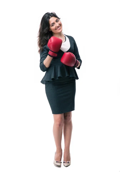 Happy businesswoman standing in boxing gloves — Stock Photo, Image