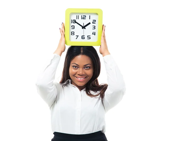 Femme d'affaires debout avec horloge sur la tête — Photo