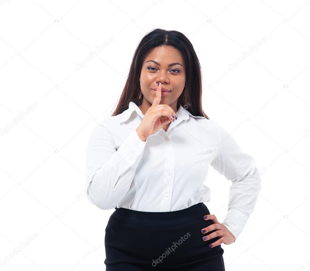 Afro american businesswoman with finger over lips