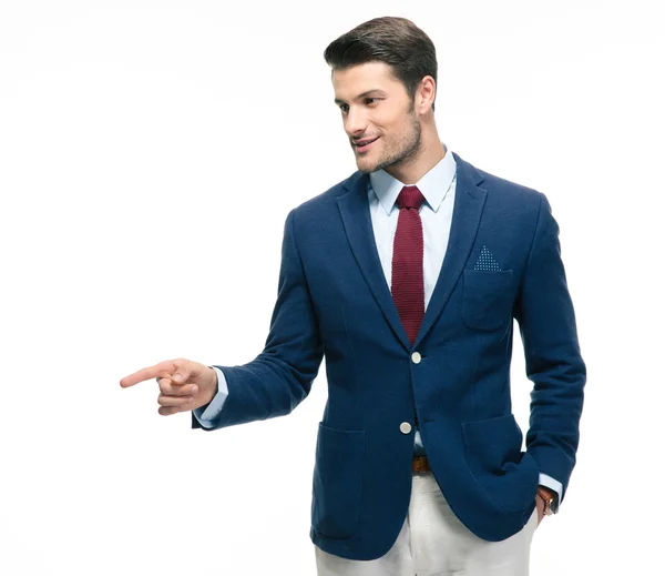 Handsome businessman pointing finger away — Stock Photo, Image