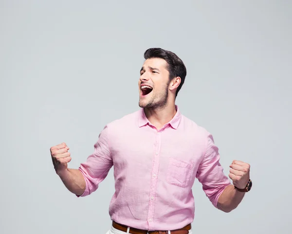 Jovem empresário comemorando seu sucesso — Fotografia de Stock