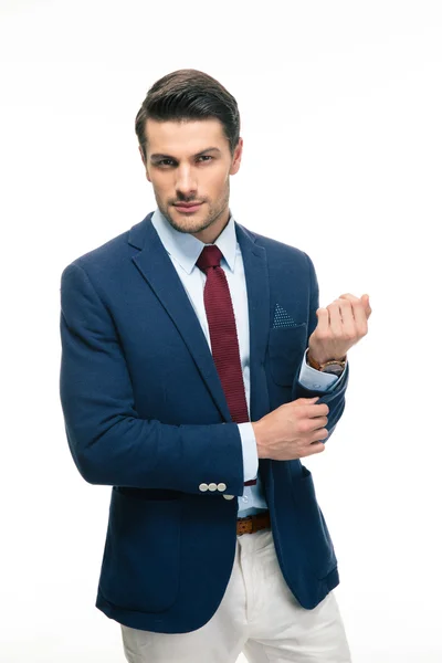 Happy handsome businessman buttoning jacket — Stock Photo, Image