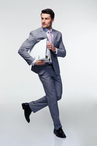 Businessman running with folders — Stock Photo, Image