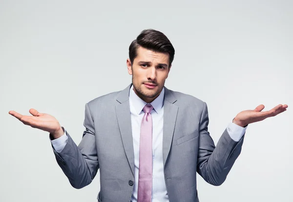 Businessman shrugging shoulders — Stock Photo, Image