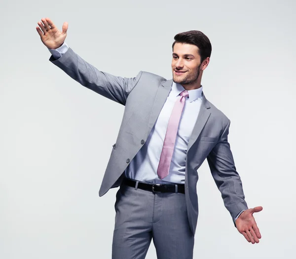 Businessman bragging about the size of something — Stock Photo, Image