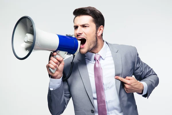 Businessman shouting in loudspeaker — Stock Photo, Image