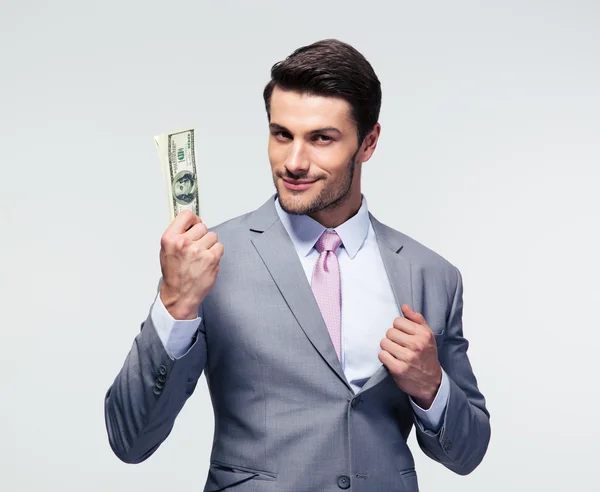 Счастливый бизнесмен держит нас доллары — стоковое фото