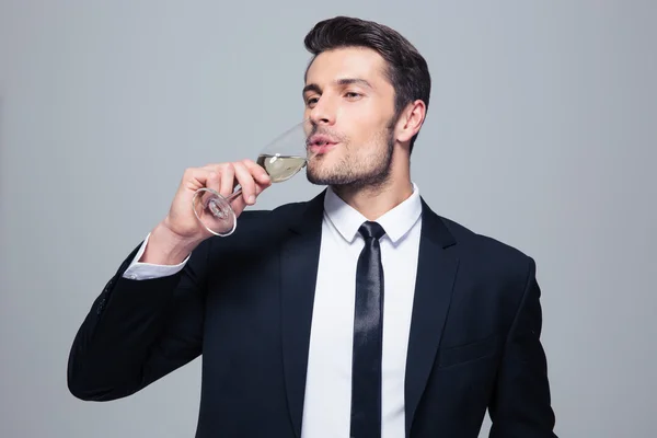 Businessman drinking champagne — Stock Photo, Image