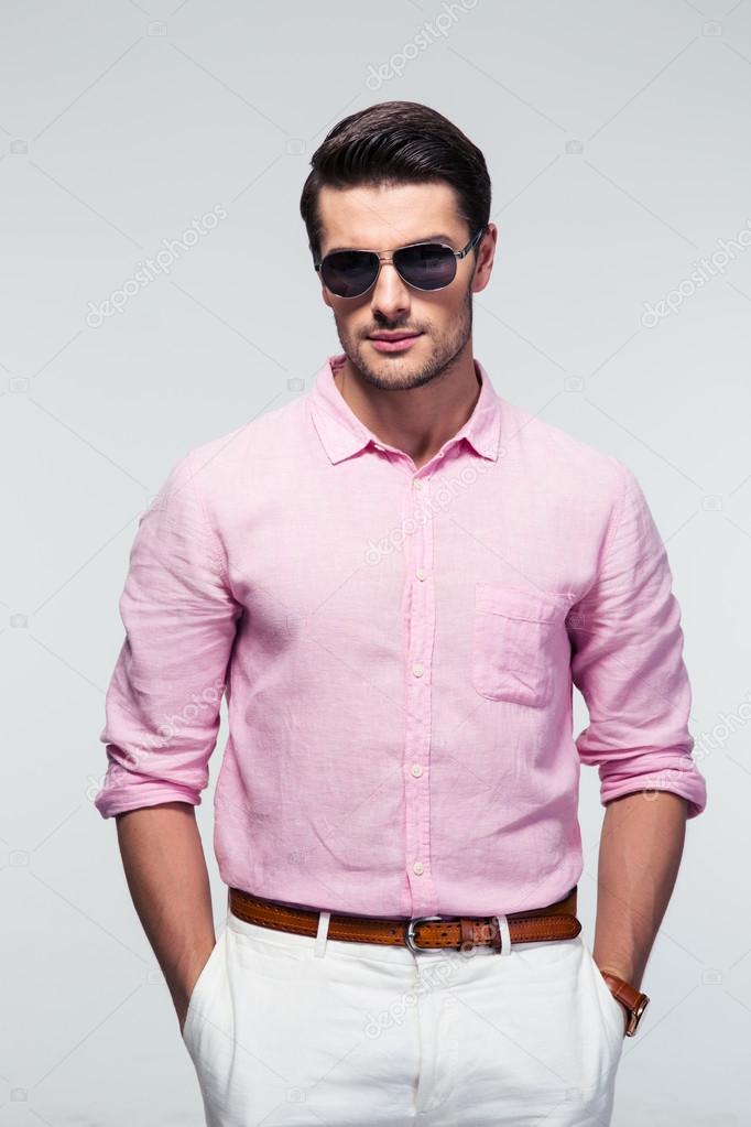 Portrait of a trendy man in sunglasses 