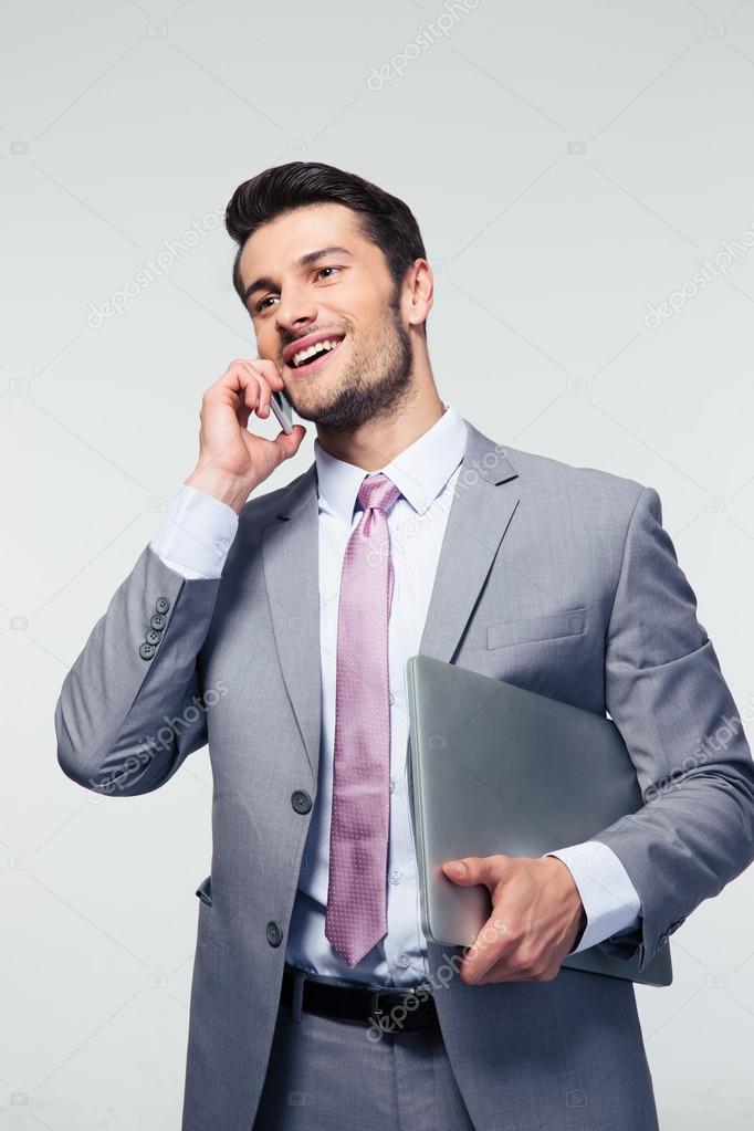 Happy businessman talking on the phone