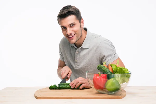 Happy man cutting vegetables — Stock Photo, Image