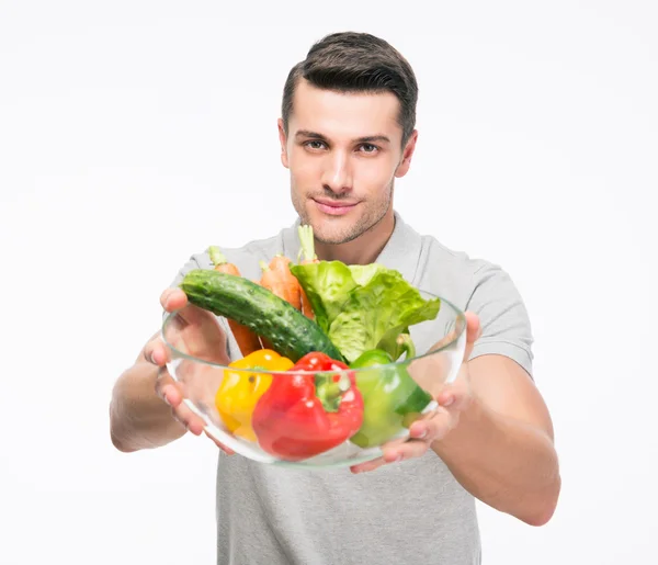 Happy man holding bowl with vegetables — Stock Photo, Image