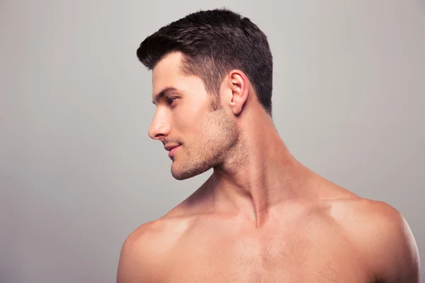 Young man with naked torso looking away — Stock Photo, Image