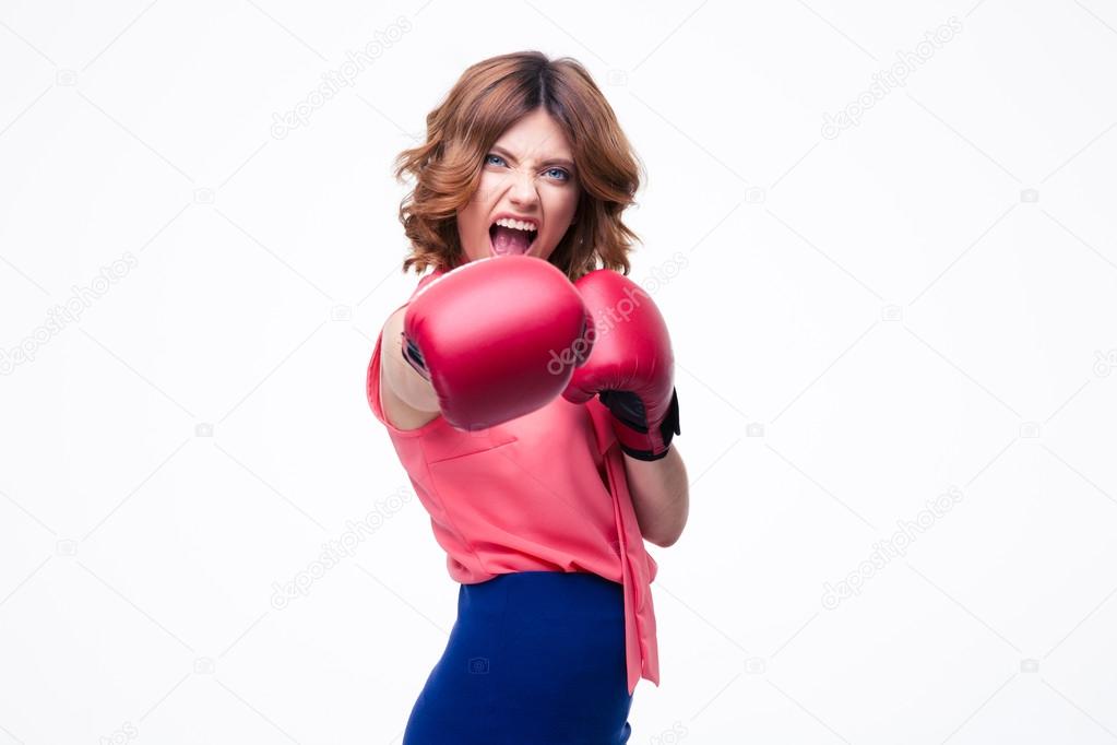 Angry elegant woman with boxing gloves fighting