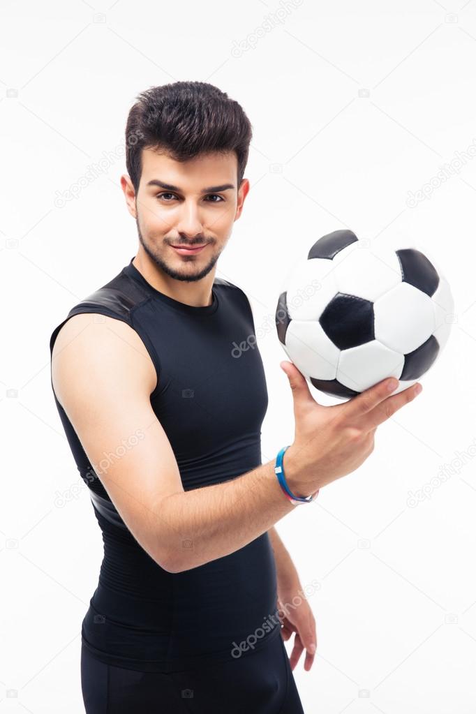 Happy soccer player holding ball