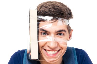 kafasına sıkıntısı çeken kitap ile erkek öğrenci