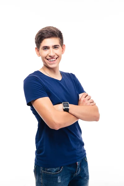 Smiling young casual man standing with arms folded — Stock Photo, Image