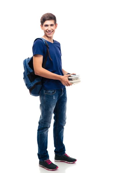 Joyeux mâle étudiant tenant des livres — Photo