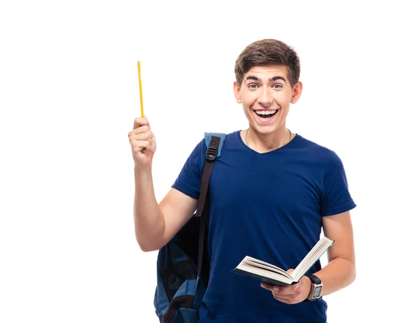 Alegre estudante do sexo masculino segurando livro e lápis — Fotografia de Stock