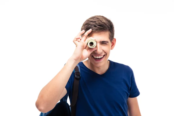 Studente maschio guardando la fotocamera attraverso i soldi — Foto Stock