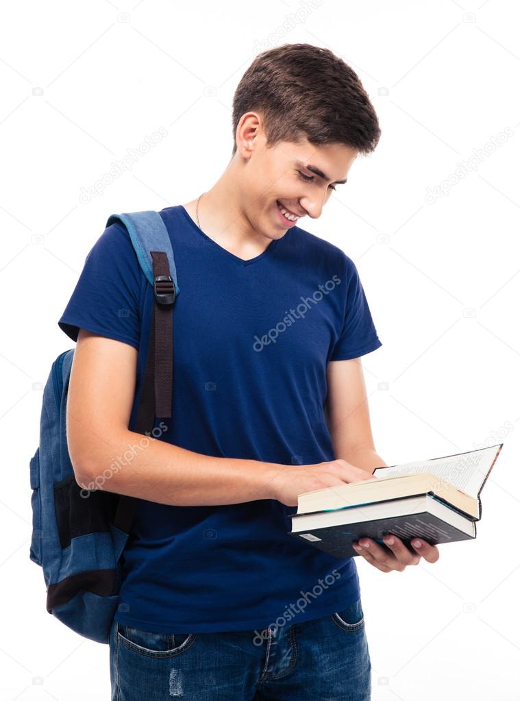 Smiling male student reading book 