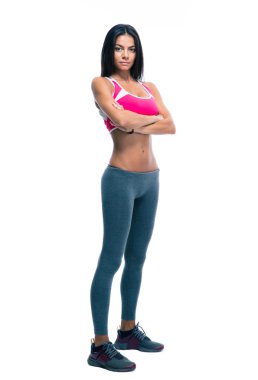 Sporty woman standing with arms folded