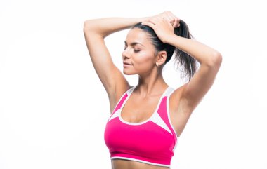 Fitness woman making ponytail