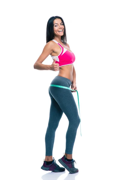 Sporty woman measure her buttocks with a measuring tape — Φωτογραφία Αρχείου