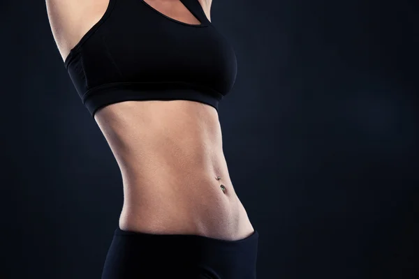 Closeup of a fit woman's abs — Stockfoto