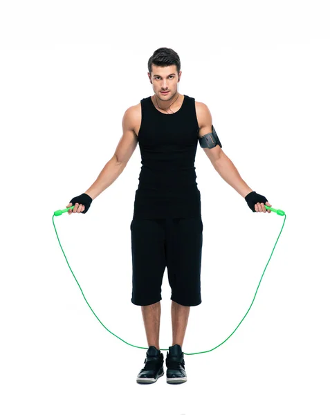 Handsome man working out with skipping rope — Stock Photo, Image