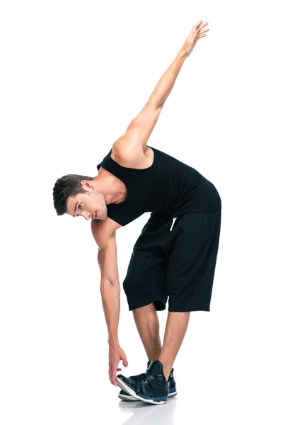 Sports man doing exercises for warm up — Stock Photo, Image