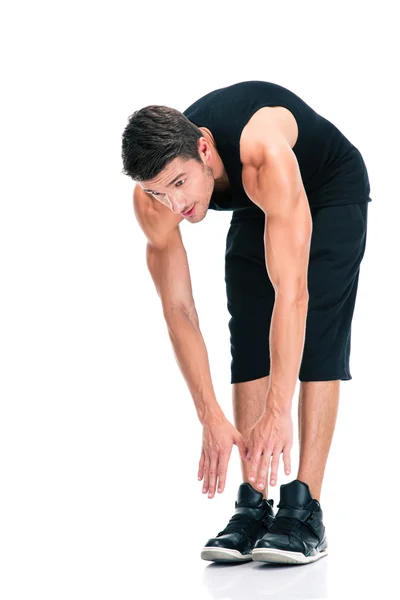 Sports man doing exercises for warm up — Stock Photo, Image