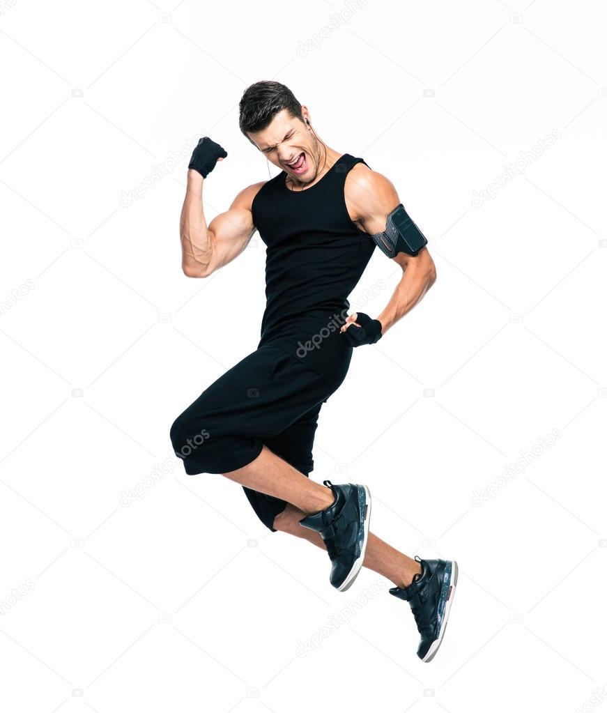 Cheerful fitness man jumping 