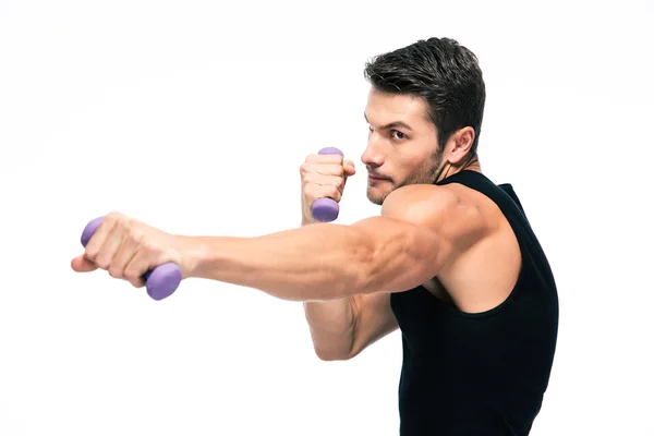 Sports man working out with small dumbbells — Stockfoto