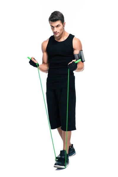 Handsome man with skipping rope — Stockfoto