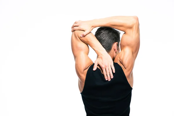 Muskulöser Mann streckt die Hände — Stockfoto