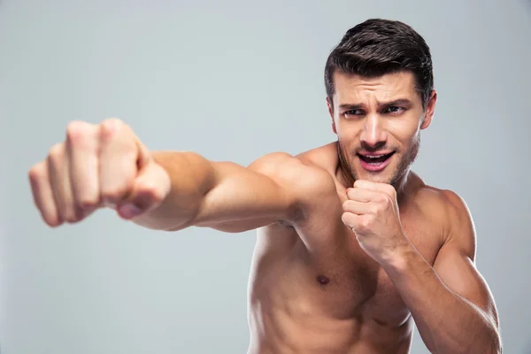 Muscular man fighting — Stock Photo, Image
