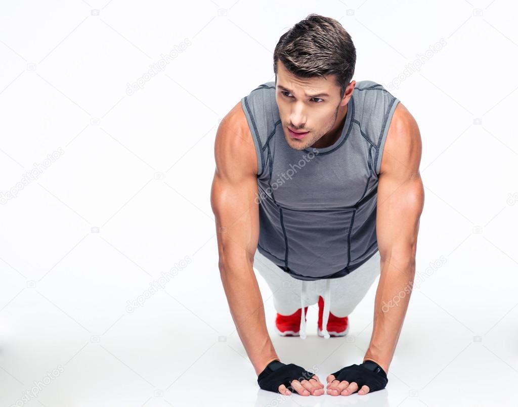 Fitness young man doing push ups