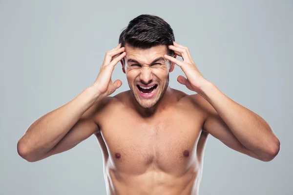 Junger Mann mit Kopfschmerzen — Stockfoto