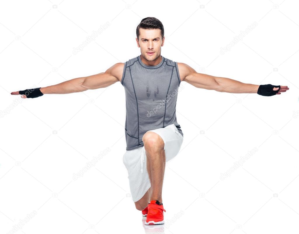 Full length portrait of a fitness man stretching 