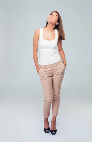 Full length portrait of a happy woman looking up — Stock Photo, Image