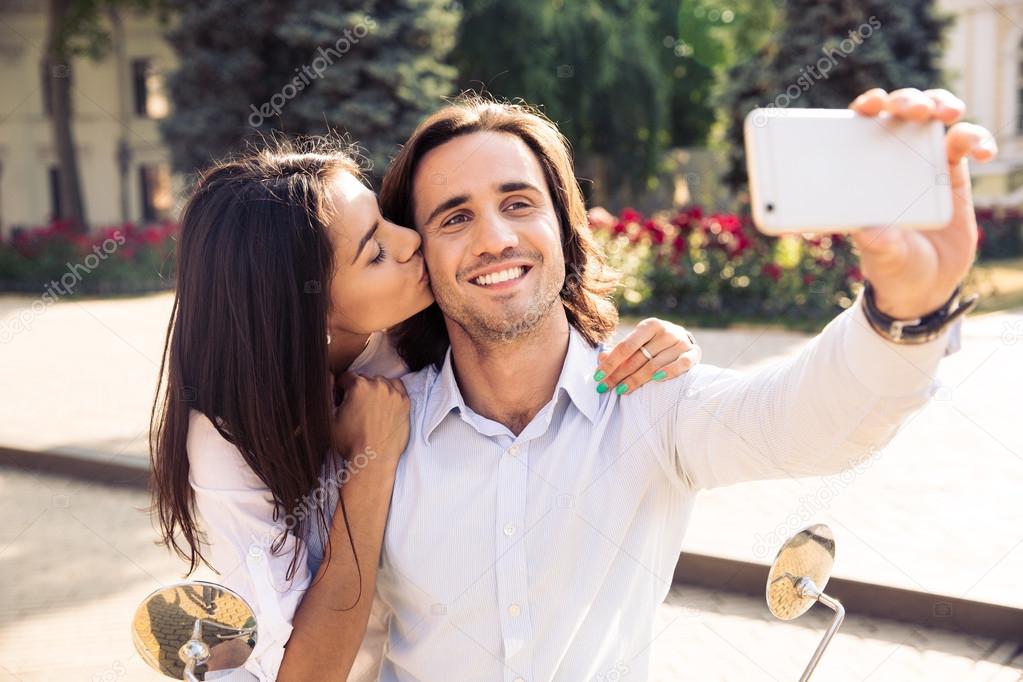 Happy couple making selfie photo