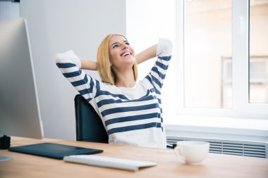 Female designer resting in office