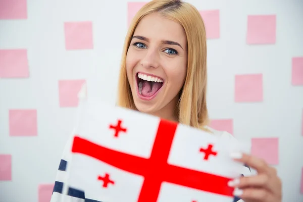 Chica sosteniendo bandera de Georgia —  Fotos de Stock