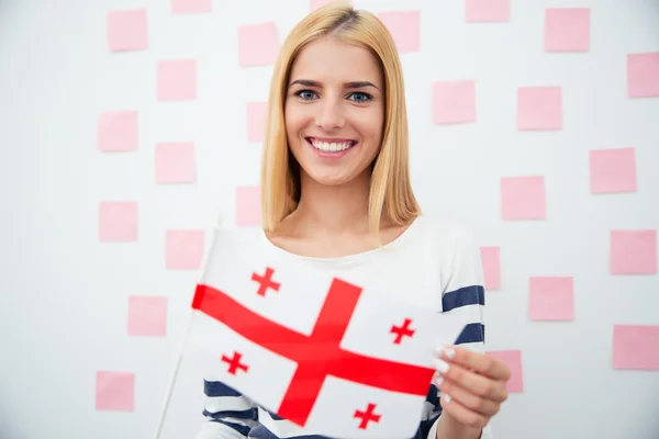 Woman holding Georgia flag — Stockfoto