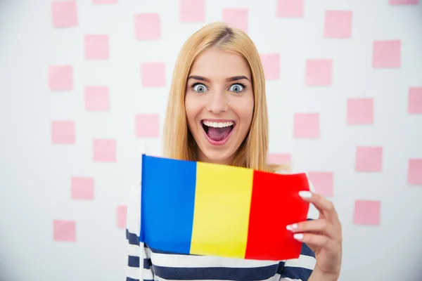 Cheerful woman holding Romanian flag — Stockfoto