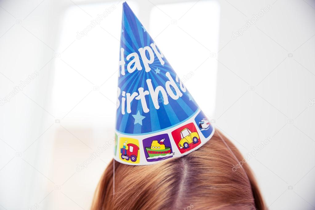 Female head with party hat