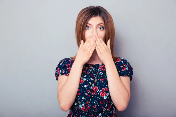 Scared woman covering her lips — Stock Photo, Image